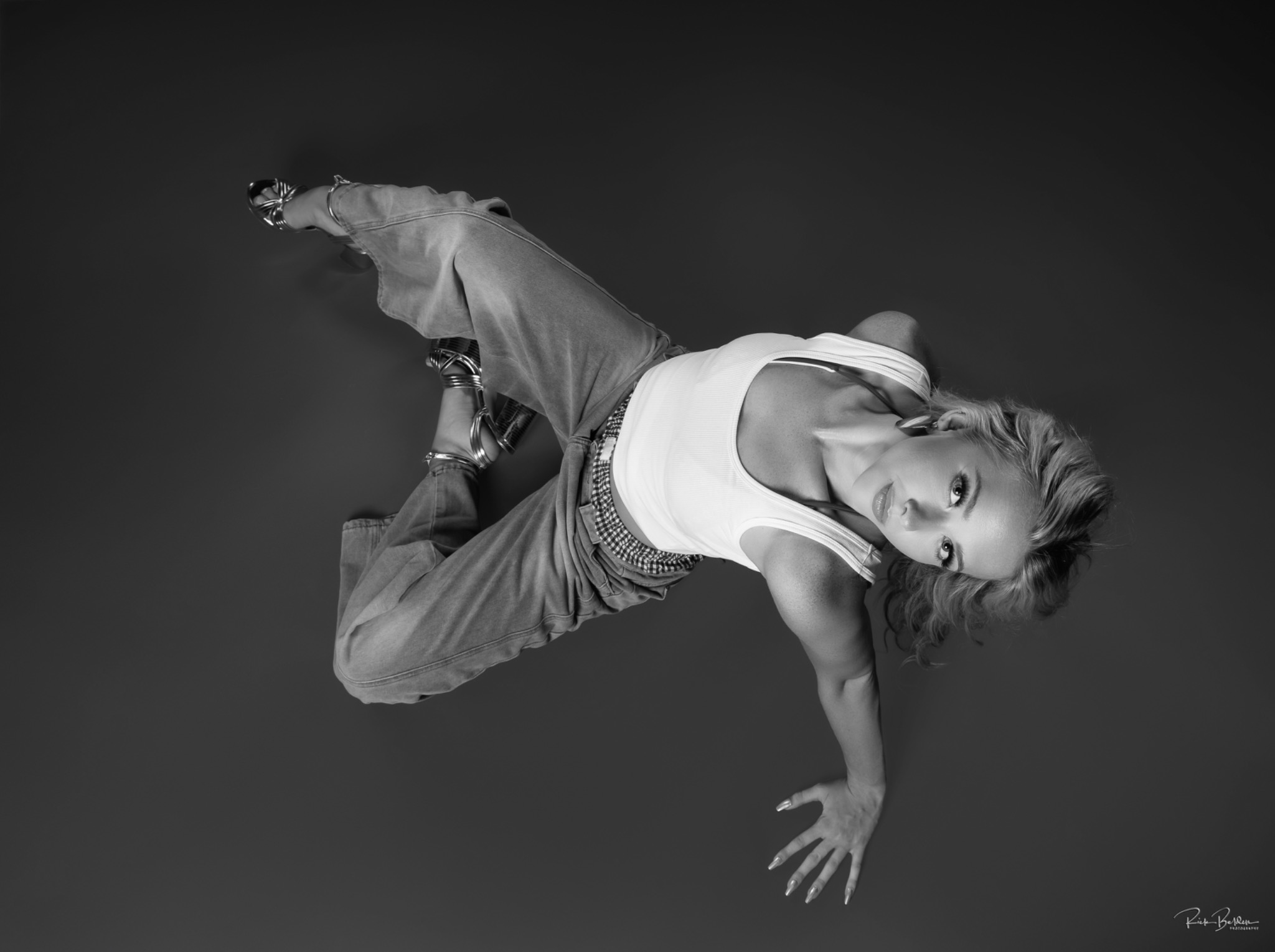 Black and white portrait of Maggie in a floor pose