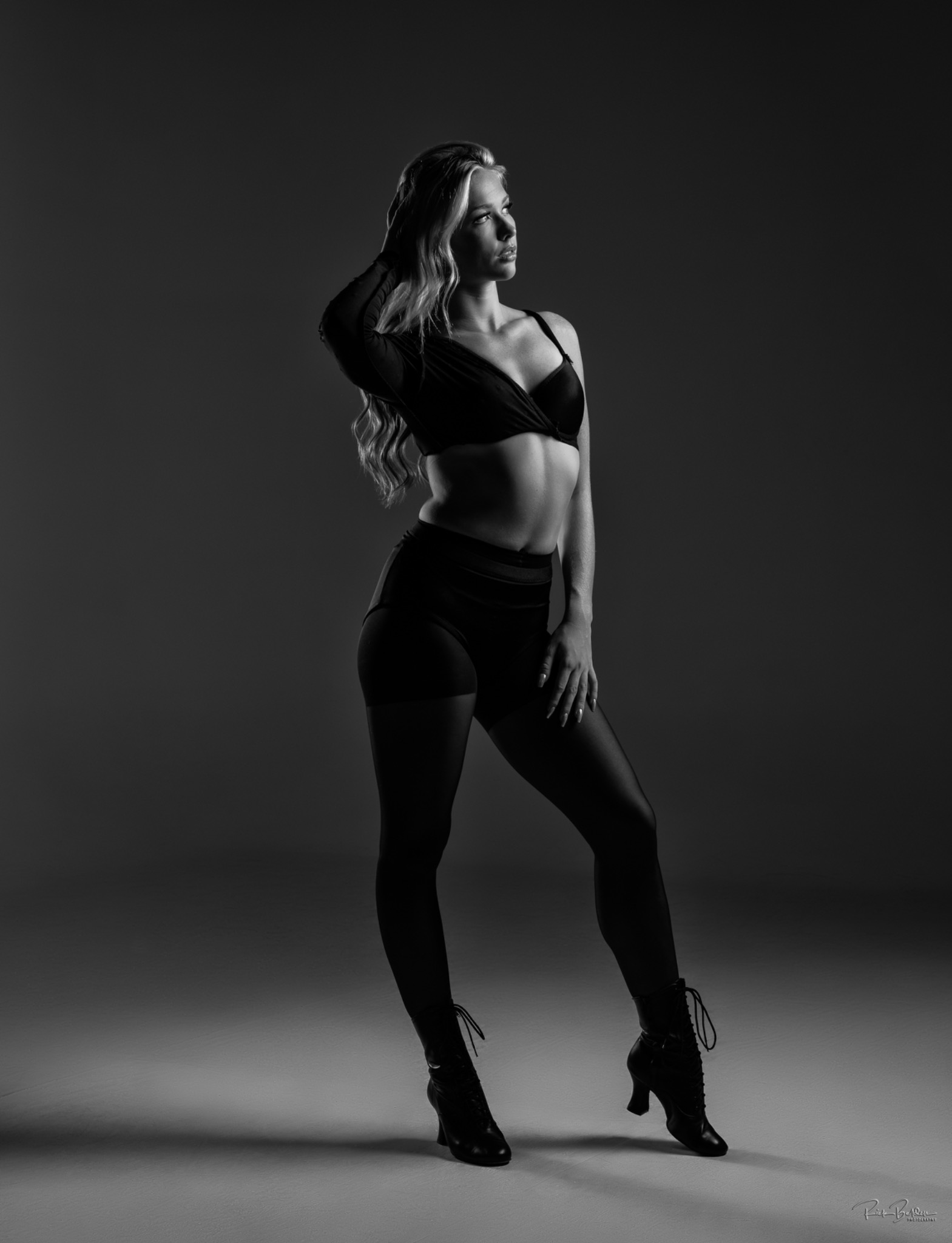 Black and white full-body portrait of Maggie in a dance pose